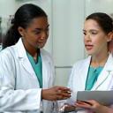 Vet communicating with referrer at the clinic