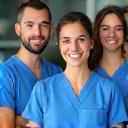 Team of veterinary professionals in scrubs smiling